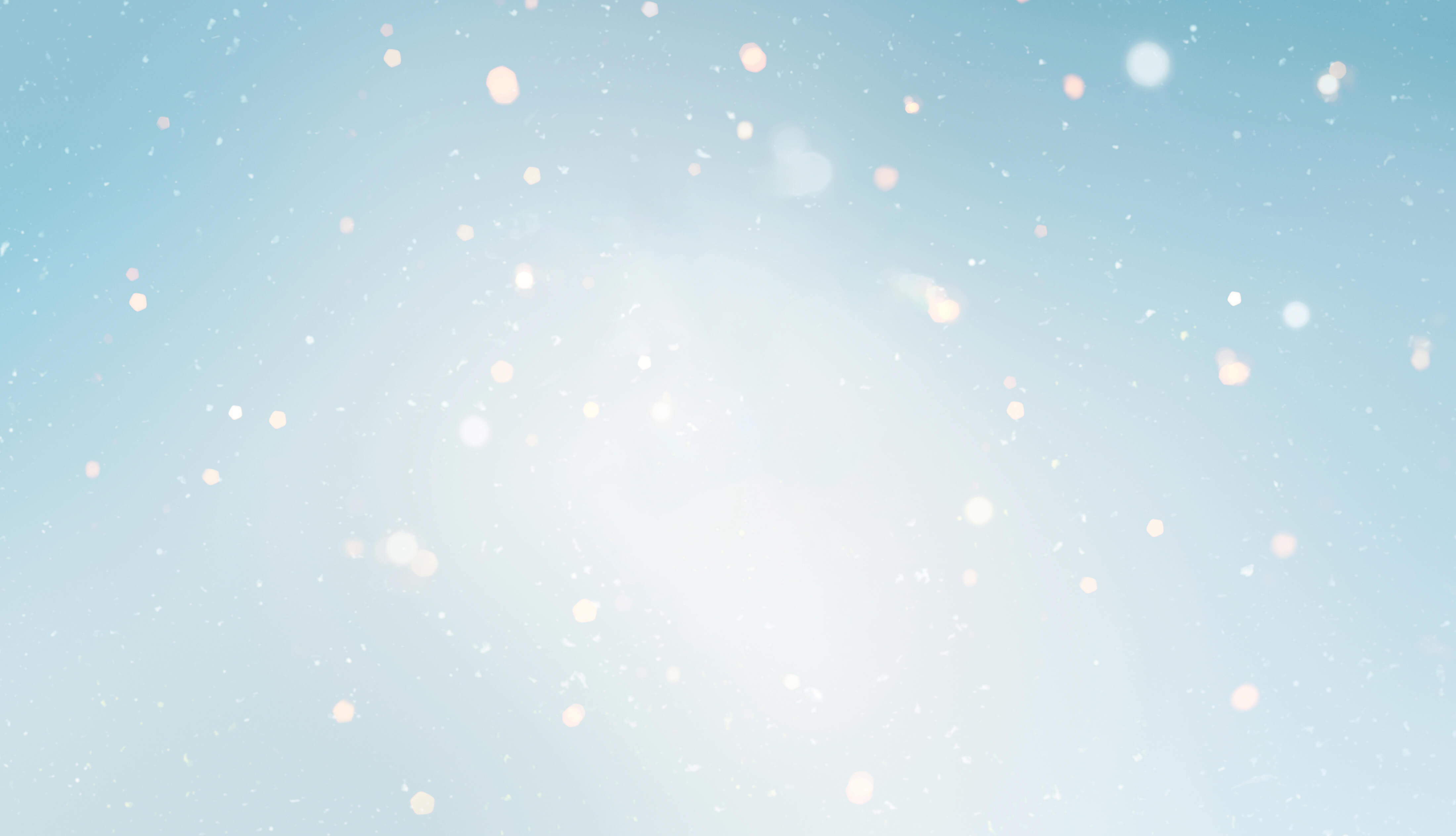 Extract of the Holiday video campaign 2025 of Clarins, showing a skier sliding down a Christmas tree filled with Clarins products.